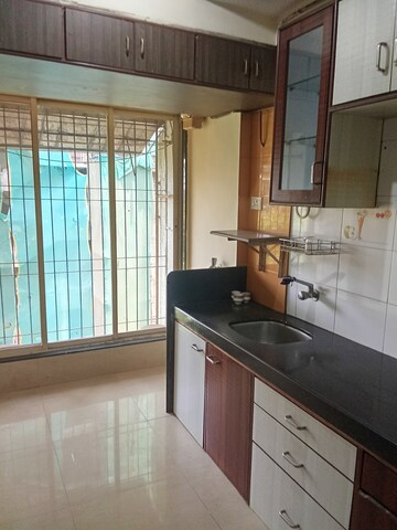Kitchen in 2 BHK Apartment at Mathura Vihar CHS, Borivali West – for Rent