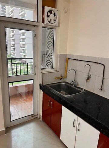 Kitchen in 3 BHK Apartment at JKG Palm Court, Sector 16c Greater Noida – for Rent