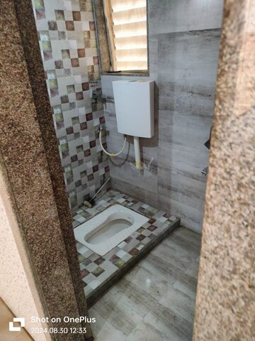 Bathroom in 1 BHK Apartment at 5P Manohar Shreeji Nirvana Phase I, Katrap – for Rent
