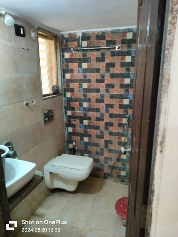 Bathroom in 1 BHK Apartment at 5P Manohar Shreeji Nirvana Phase I, Katrap – for Rent