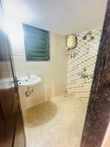Bathroom in 1 BHK Apartment at Pranjee Garden City Phase 2, Katrap – for Rent