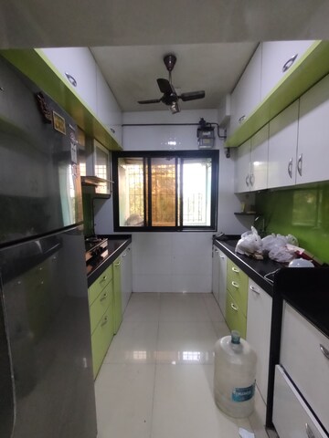 Kitchen in 3 BHK Apartment at Shree Balaji Satyam Towers, Kopar Khairane – for Rent