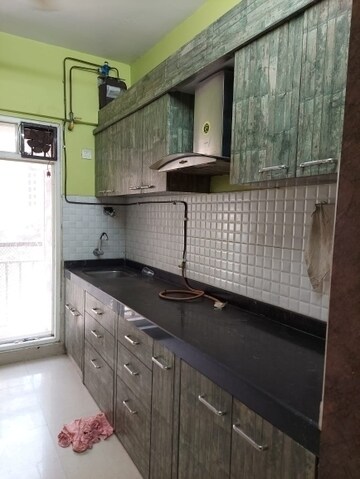 Kitchen in 1 BHK Apartment at Raunak Bliss B2, Ghodbunder Road – for Rent