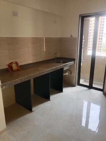 Kitchen in 1 BHK Apartment at Sunteck West World, Naigaon East – for Rent