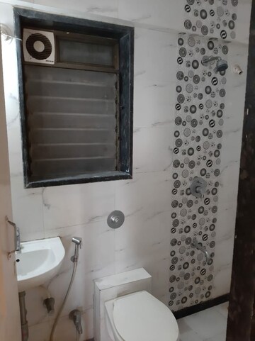 Bathroom in 2 BHK Apartment at Nav Aasawari CHS, Andheri East – for Sale