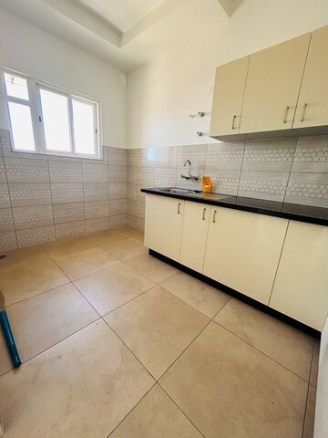 Kitchen in 3 BHK Apartment at Bhartiya Nikoo Homes Phase 2, Thanisandra Main Road – for Rent