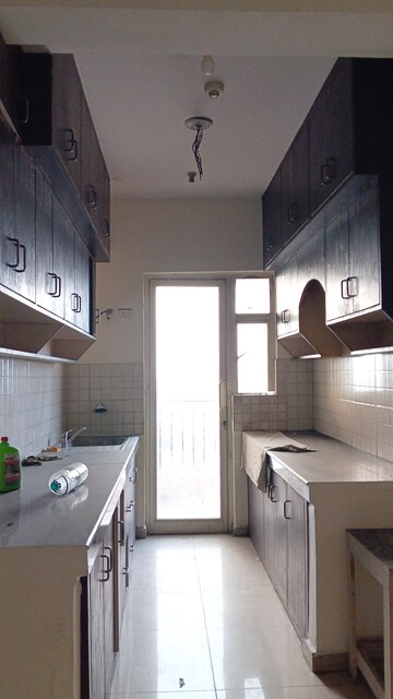 Kitchen in 3 BHK Apartment at Landcraft Golflinks Plaza, Pandav Nagar – for Rent