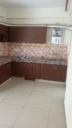 Kitchen in 2 BHK Apartment at Kingson Green Villa Phase 2, Panchsheel Green – for Sale