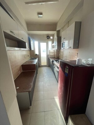 Kitchen in 3 BHK Apartment at Mahagun Moderne, Sector 78 – for Sale