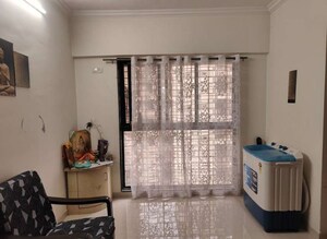 Living Room in 1 BHK Apartment at Raunak Heights, Ghodbunder Road – for Sale