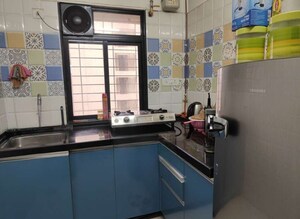 Kitchen in 1 BHK Apartment at Raunak Heights, Ghodbunder Road – for Sale