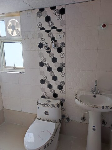Bathroom in 2 BHK Apartment at Raj Nagar Extension – for Sale