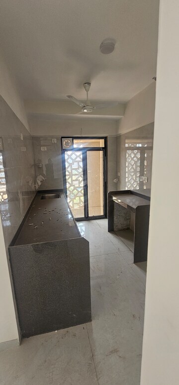 Kitchen in 3 BHK Apartment at Modirealty Wisteria, Kandivali West – for Sale