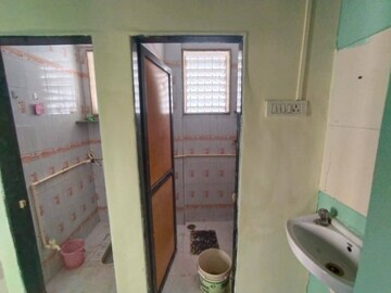 Bathroom in 1 BHK Apartment at Atharva CHS, Khanda Colony – for Rent