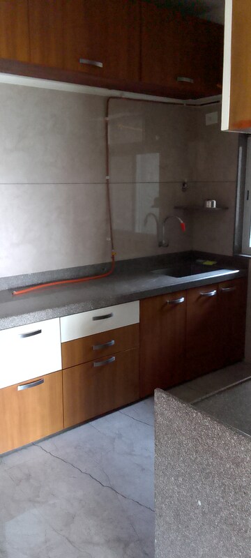 Kitchen in 3 BHK Apartment at Paranjape Schemes Royal Court, Andheri East – for Rent