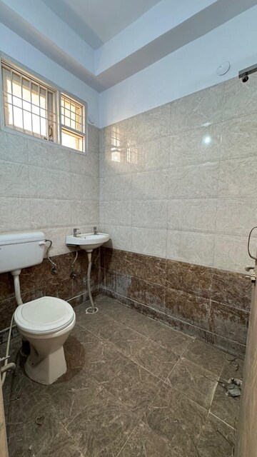 Bathroom in 4 BHK Apartment at Khanpur – for Sale
