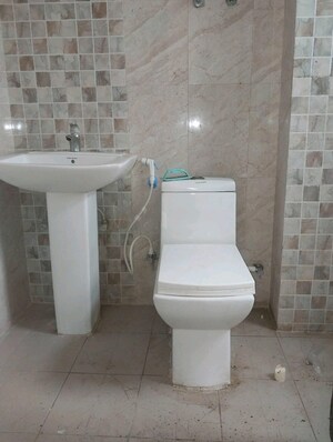 Bathroom in 2 BHK Apartment at Aims Golf City, Sector 75 – for Sale