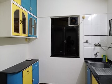 Kitchen in 2 BHK Apartment at Montreal Tower, Andheri West – for Rent