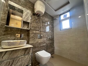 Bathroom in 3 BHK Builder Floor at Mansarover Garden – for Sale