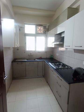 Kitchen in 4 BHK Builder Floor at Ansal API Esencia, Sector 67 – for Rent
