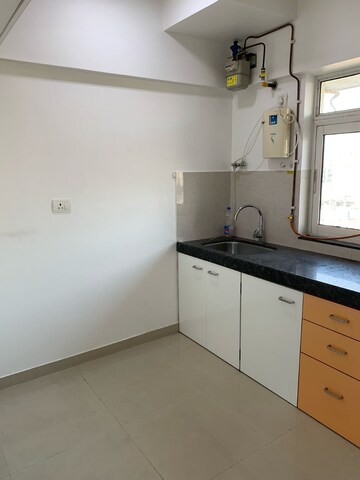 Kitchen in 2 BHK Apartment at Cosmos Empress Park, Ghodbunder Road – for Rent