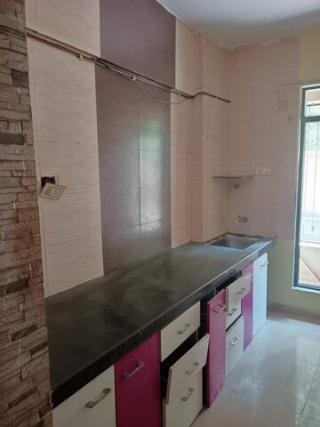 Kitchen in 1 BHK Apartment at Pranjee Garden City, Katrap – for Rent