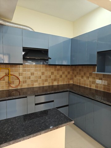 Kitchen in 2 BHK Apartment at Mahagun Mywoods III, Sector 16c Greater Noida – for Rent