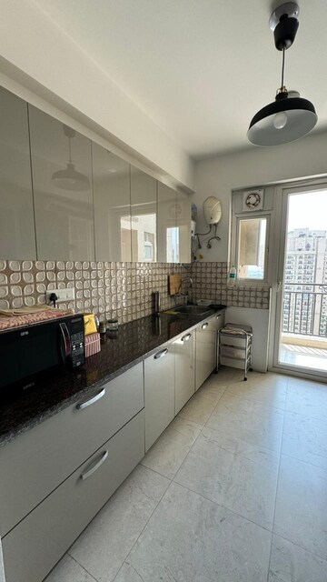 Kitchen in 2 BHK Apartment at Supertech Czar Suites, Omicron I Greater Noida – for Sale