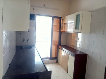 Kitchen in 1 BHK Apartment at Shree Ostwal Orchid Building No 9 to 12, Mira Road – for Sale