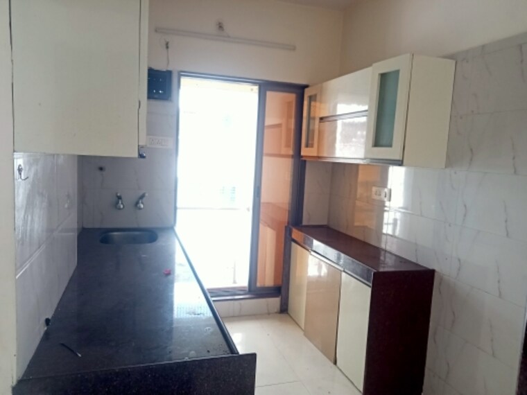 Kitchen, shree-ostwal-orchid-building-no-9-to-12 1 Bedroom 645 Sq.Ft. Apartment In Mira Road Thane 8585604