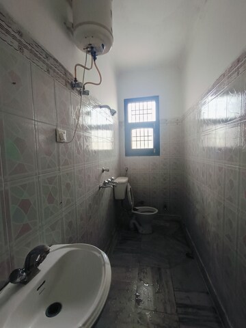 Bathroom in 1.5 BHK Apartment at Sunny Enclave – for Rent