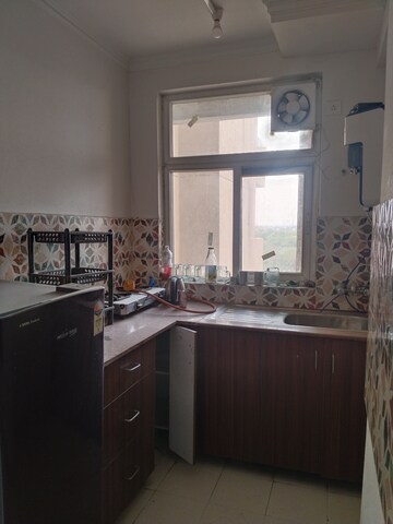 Kitchen in 2 BHK Apartment at Amrapali Leisure Park, Amrapali Leisure Valley – for Rent