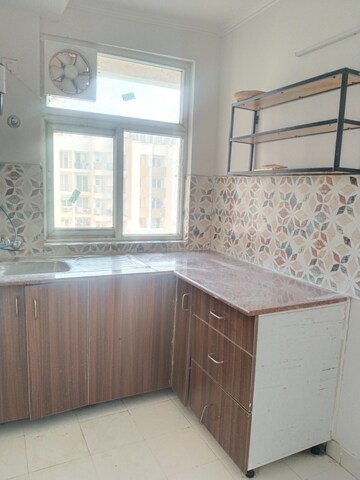 Kitchen in 2 BHK Apartment at Amrapali Leisure Park, Amrapali Leisure Valley – for Rent