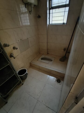 Bathroom in 2 BHK Apartment at Lokpuram CHS, Vasant Vihar – for Rent