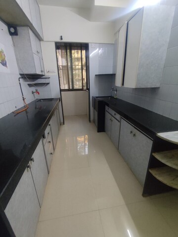 Kitchen in 2 BHK Apartment at Mota Mahal Apartment, Andheri West – for Rent