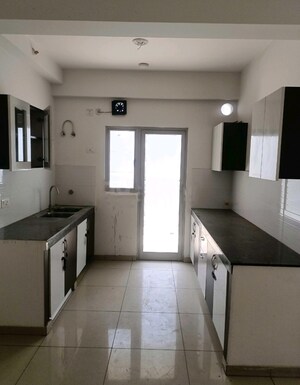 Kitchen in 2 BHK Apartment at Amrapali Silicon City, Sector 76 – for Sale