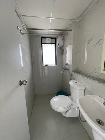 Bathroom in 3 BHK Apartment at Runwal Gardens, Dombivli East – for Rent