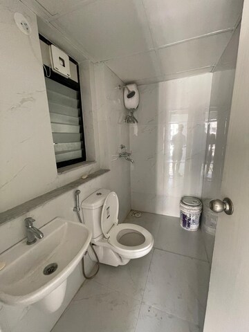 Bathroom in 1 BHK Apartment at Runwal Gardens, Dombivli East – for Rent