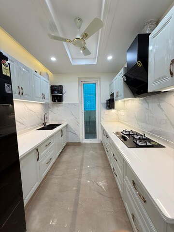 Kitchen in 4 BHK Apartment at Capital Royal Casa, Gms Road – for Sale