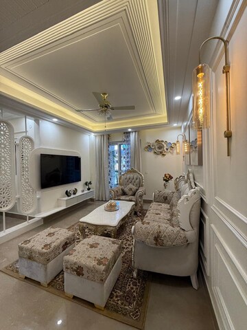 Living Room in 4 BHK Apartment at Capital Royal Casa, Gms Road – for Sale