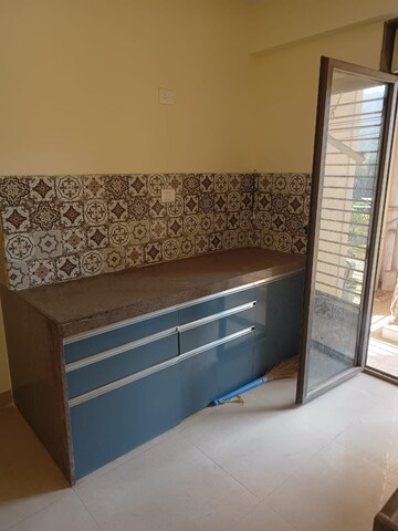 Kitchen in 2.5 BHK Apartment at Bhimjyani Verraton, Manpada – for Sale