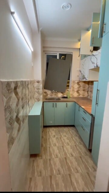 Kitchen in 2 BHK Apartment at Amrapali Golf Homes, Sector 4 Greater Noida – for Rent