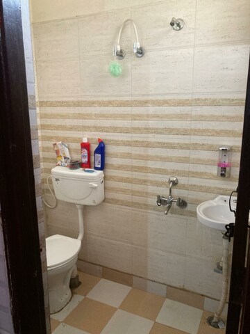 Bathroom in 2 BHK Apartment at Nilaya Greens, Raj Nagar Extension – for Rent