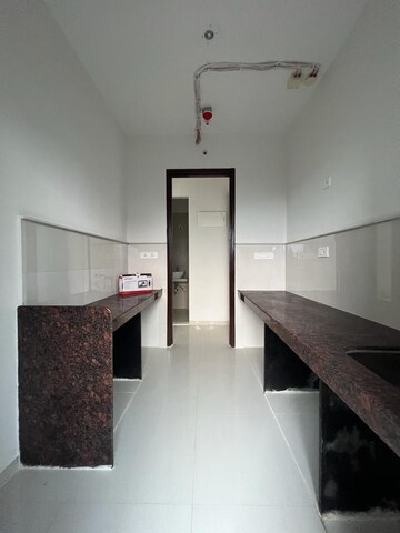 Kitchen in 1 BHK Apartment at Parsik Nagar – for Sale