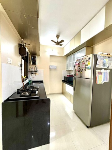 Kitchen in 1.5 BHK Apartment at Shree Satya Shankar Residency, Manpada – for Sale