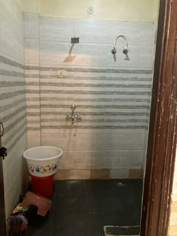 Bathroom in 2 BHK Apartment at Charms Castle, Raj Nagar Extension – for Rent