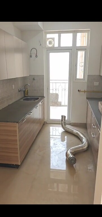 Kitchen in 3.5 BHK Apartment at ATS Nobility, Sector 4 Greater Noida – for Rent