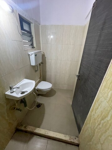 Bathroom in 2 BHK Apartment at Gaurav Woods Phase I, Mira Road – for Rent