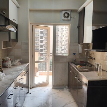 Kitchen in 2 BHK Apartment at Geotech Pristine Avenue, Sector 16c Greater Noida – for Rent