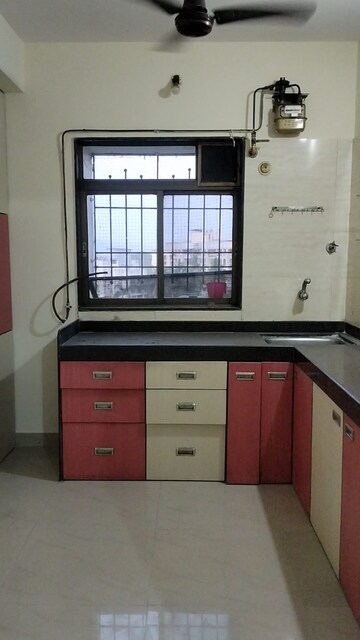Kitchen in 1.5 BHK Apartment at Rutu Estate, Brahmand – for Rent